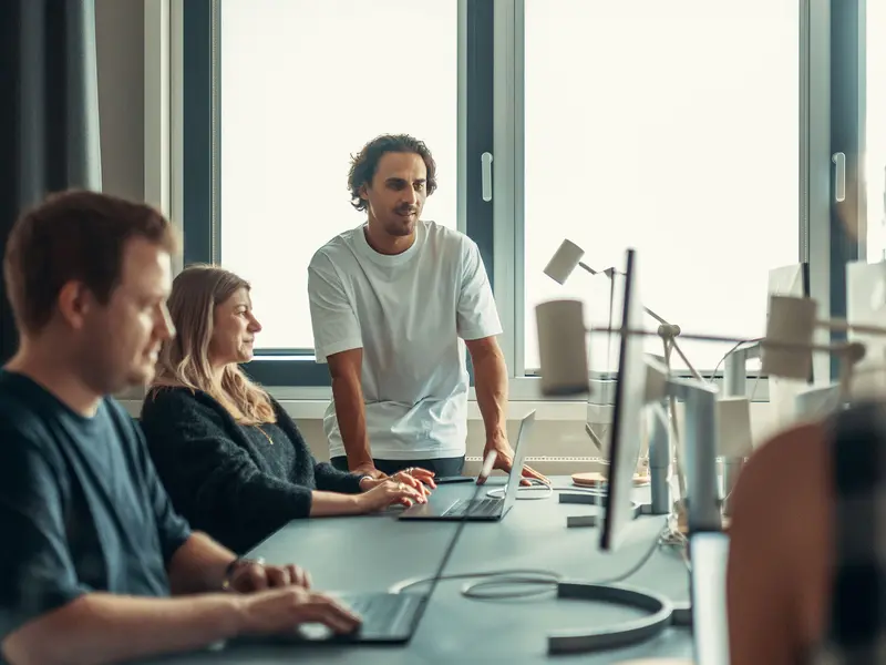 A team working together at a shared desk